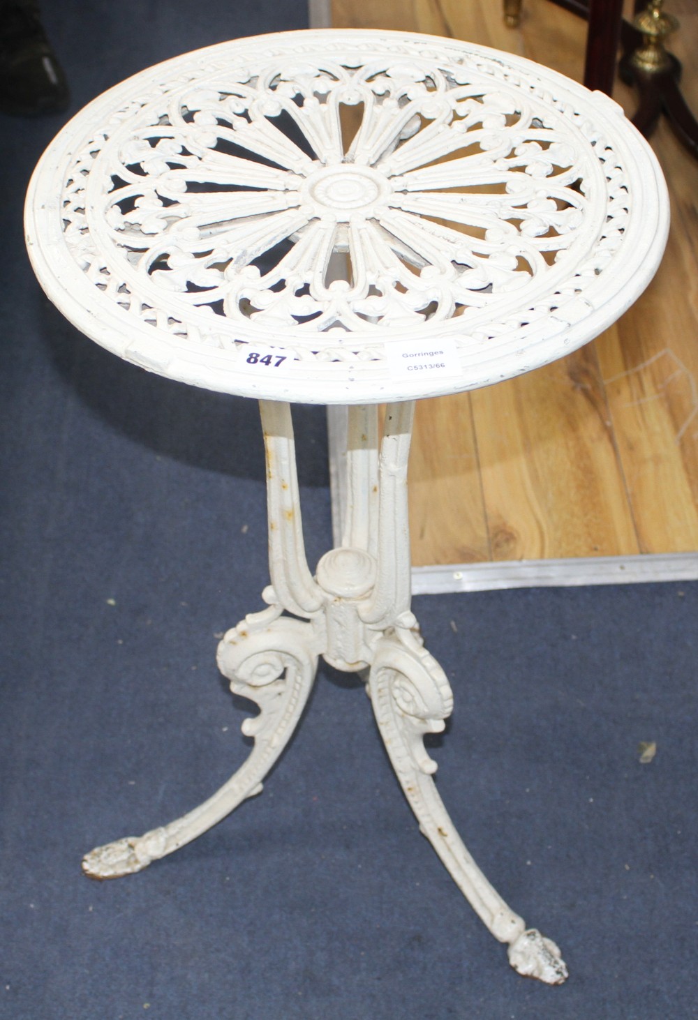 A Coalbrookdale style cast iron and aluminium circular tripod table, Diam.42cm H.68cm